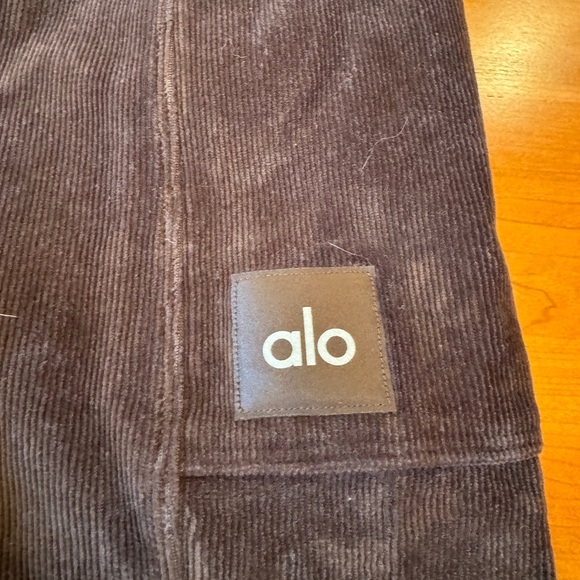 ALO YOGA MICRO CORDUROY HIGH WAIST WINTER BREAK FLARE PANTS. BROWN. MEDIUM. - Picture 2 of 4
